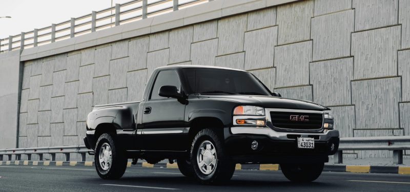 Black GMC on highway, GMC