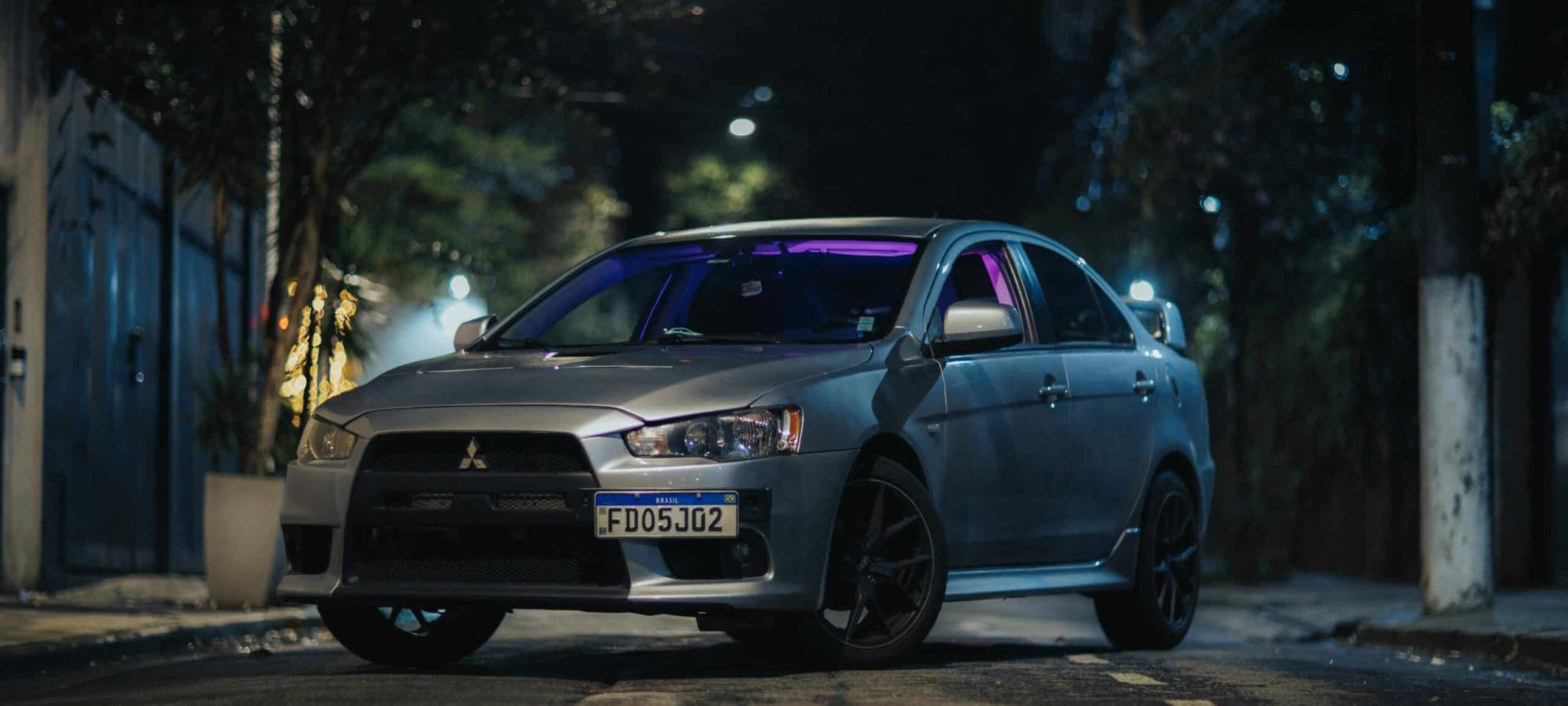 A silver Mitsubishi Lancer by Metheus Bertelli
