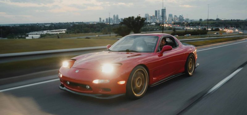 A red Mazda RX-7 by Deane Bayas