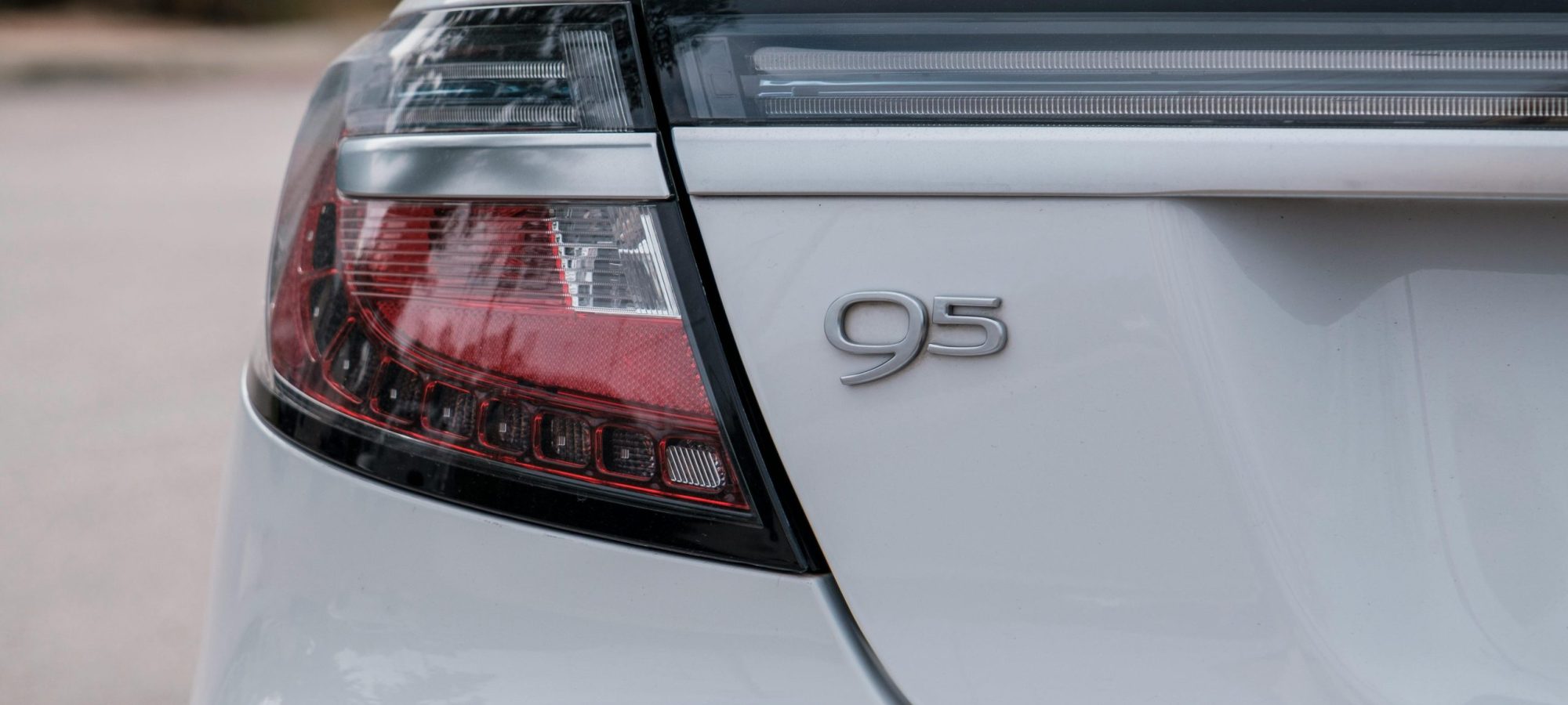 Detail of a 9-5 SAAB taillight and emblem captured in San Antonio. by John Hill via pexels