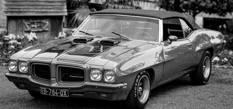 Monochrome photo of a vintage Pontiac GTO classic car by Jean Marc Bonnel via pexels