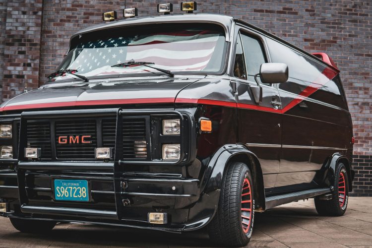 Black Glossy GMC Vandura Van with American Flag by Sebastian Dziomba
