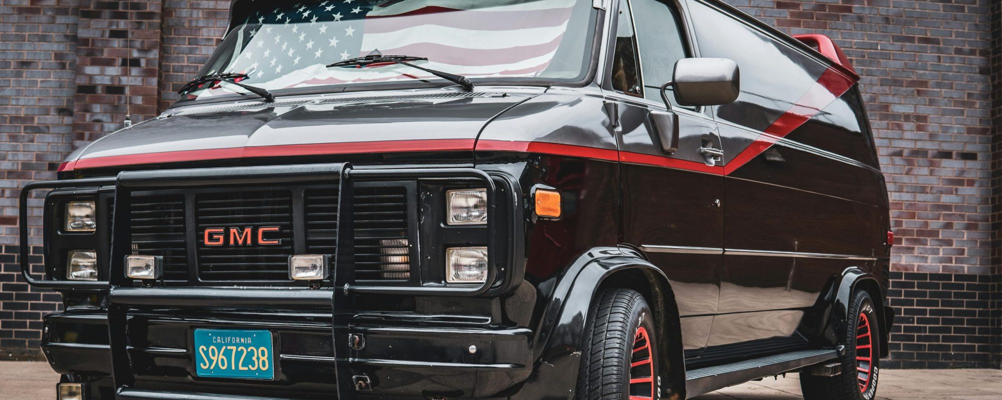 Black Glossy GMC Vandura Van with American Flag by Sebastian Dziomba