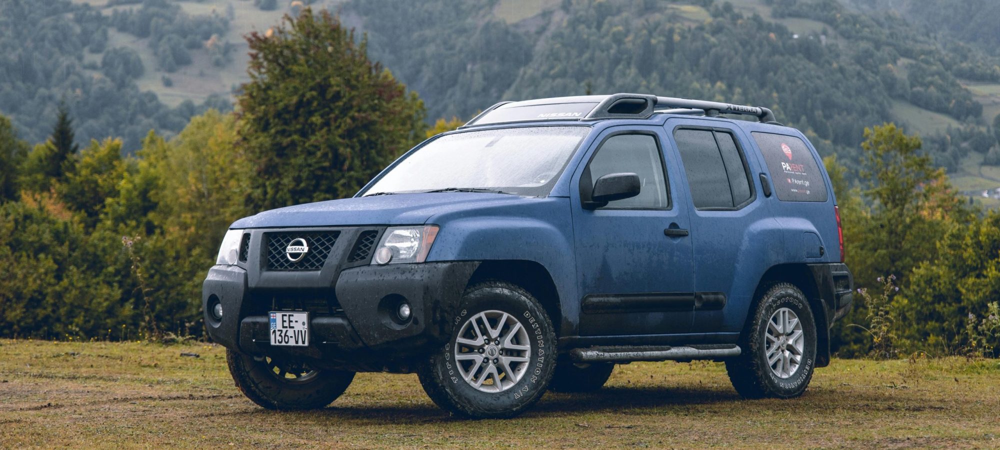 A rugged blue Nissan SUV parked by Tomas Malik via pexels. Nissan wheel spacers / adapters