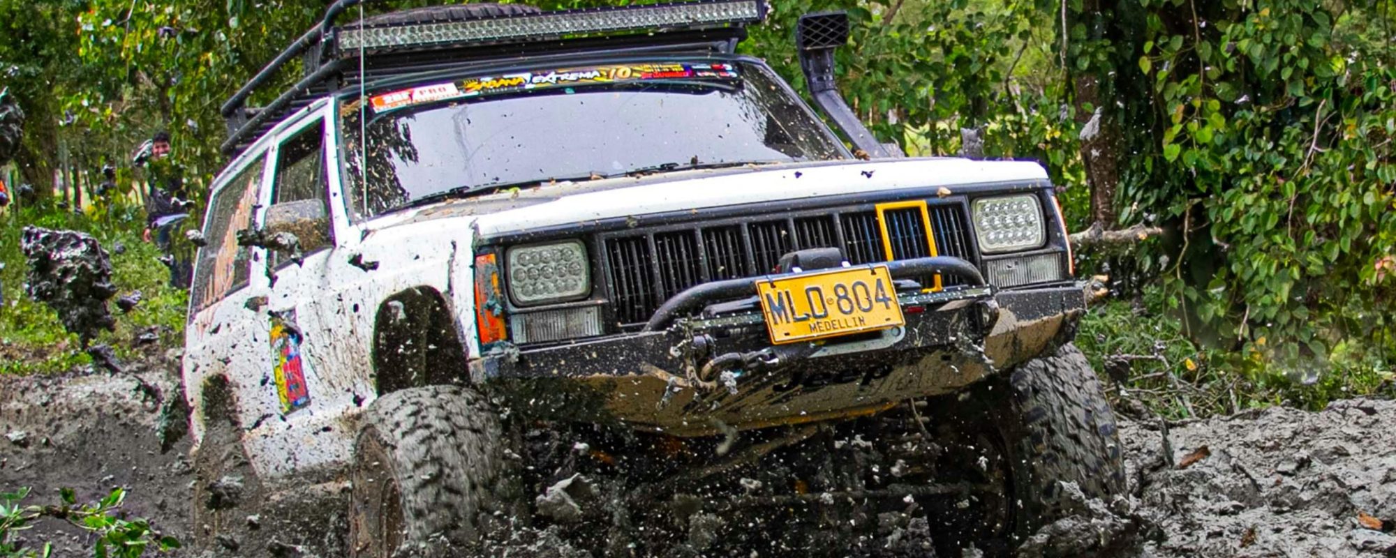 Jeep driving through challenging muddy terrain by Robin Ramos Jeep Grand Cherokee Wheel Spacers / adapters