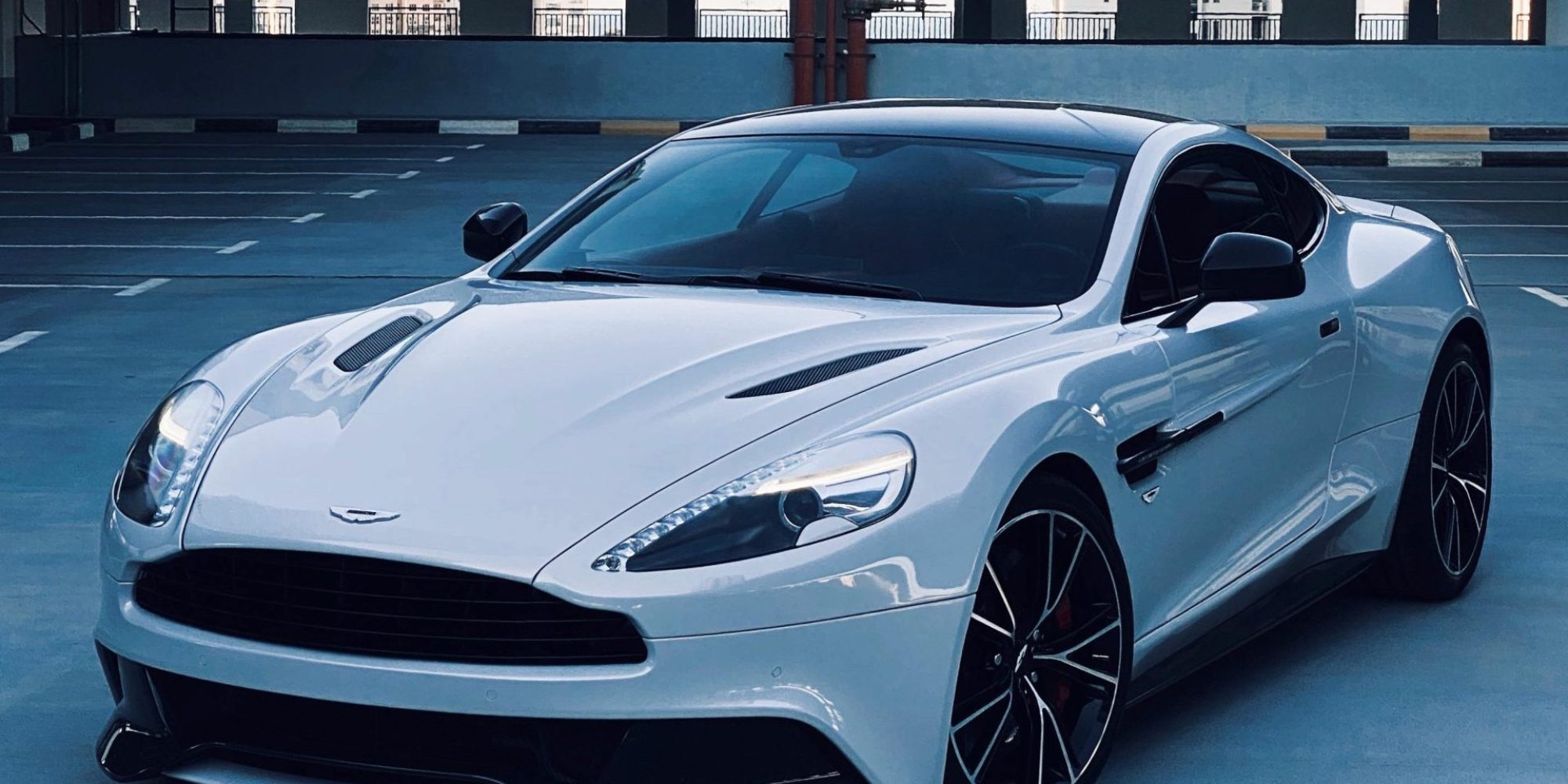 A sleek, white Aston Martin Vanquish. Aston Martin Wheel Spacers / Adapters