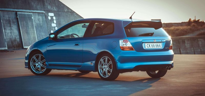 Stylish blue hatchback parked outdoors in Denmark, showcasing modern design.
